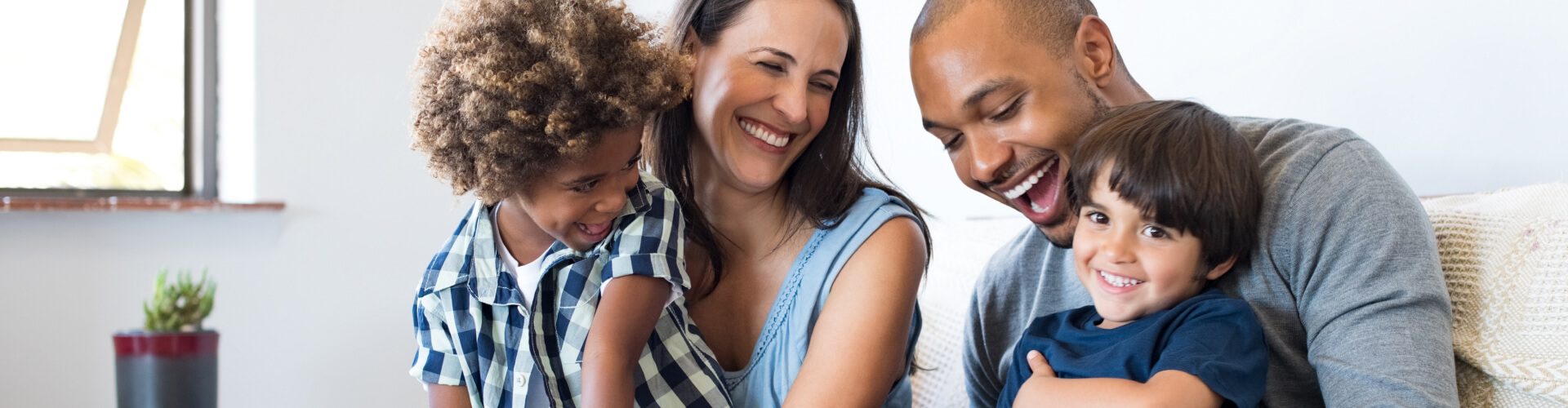 "family laughing and hugging"